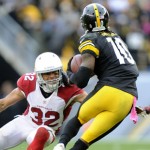 Pittsburgh Steelers wide receiver Martavis Bryant (10) evades Arizona Cardinals free safety Rashad Johnson (26) and Tyrann Mathieu (32) on his way to a touchdown after making a catch in the fourth quarter an NFL football game against the Pittsburgh Steelers, Sunday, Oct. 18, 2015 in Pittsburgh. The Steelers won 25-13. (AP Photo/Don Wright)