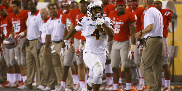 Arizona State running back Demario Richard (4) runs past the New Mexico bench for a 93 yard touchdo...