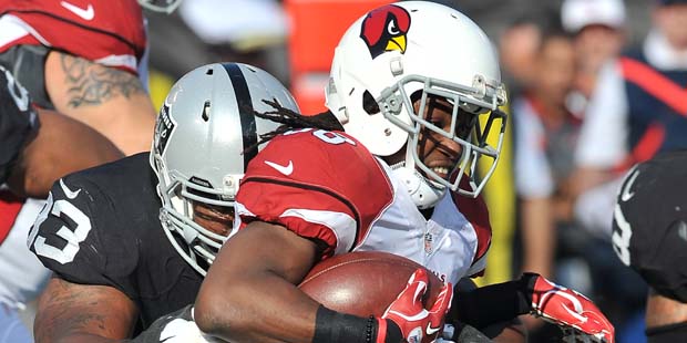 Arizona Cardinals running back (38) Andre Ellington tries to get away from Oakland Raiders defensiv...