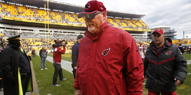 Arizona Cardinals head coach Bruce Arians walks off the field after an NFL football game against th...