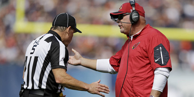 Arizona Cardinals head coach Bruce Arians argues a call with head linesman John McGrath (5) during ...
