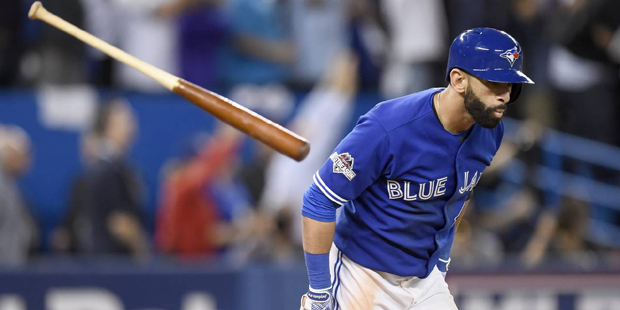 Toronto Blue Jays' Jose Bautista flips his bat after hitting a three-run home run against the Texas...