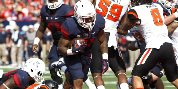 Arizona running back Orlando Bradford (21) scores a touchdown against Oregon State during the first...
