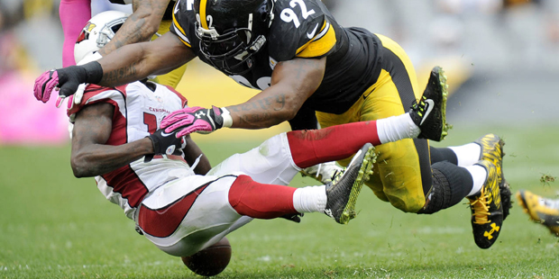 Arizona Cardinals wide receiver John Brown (12) fumbles after being hit by Pittsburgh Steelers outs...