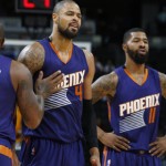 Phoenix Suns forward P.J. Tucker, left, holds back center Tyson Chandler  who argues with referees after being called for a foul while facing the Denver Nuggets in the second half of an NBA basketball game Friday, Oct. 16, 2015, in Denver. Suns forward Markieff Morris, front right, looks on. (AP Photo/David Zalubowski)