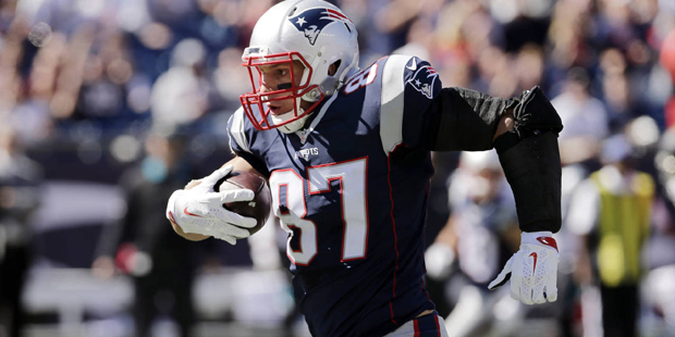 New England Patriots tight end Rob Gronkowski runs after catching a pass in the first half of an NF...