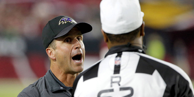 Baltimore Ravens head coach John Harbaugh yells to referee Ronald Torbert (62) during the second ha...