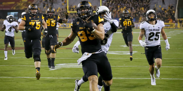 Arizona State tight end Kody Kohl (83) carries a recovered fumble for a touchdown as Colorado defen...
