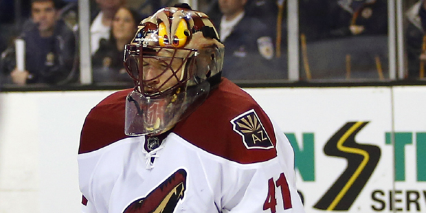 Arizona Coyotes goalie Mike Smith can't stop this goal by Boston Bruins' Zdeno Chara during the sec...