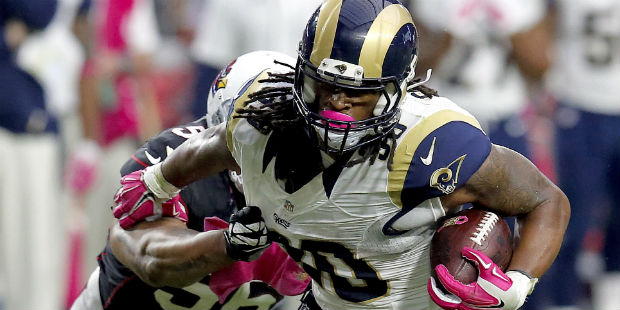 St. Louis Rams running back Todd Gurley (30) eludes the reach of Arizona Cardinals outside lineback...