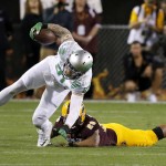 Arizona State's Viliami Moeakiola, right, dives in to tackle Oregon's Evan Baylis, left, during the first half of an NCAA college football game Thursday, Oct. 29, 2015, in Tempe, Ariz. (AP Photo/Ross D. Franklin)