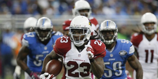 Arizona Cardinals running back Chris Johnson (23) is chased by the Detroit Lions defense during the...