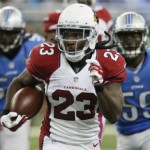 Arizona Cardinals running back Chris Johnson (23) is chased by the Detroit Lions defense during the first half of an NFL football game, Sunday, Oct. 11, 2015, in Detroit. (AP Photo/Duane Burleson)
