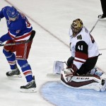 New York Rangers left wing Rick Nash (61) watches a shot by teammate Keith Yandle get past Arizona Coyotes goalie Mike Smith (41) for a goal during the third period of an NHL hockey game Thursday, Oct. 22, 2015, in New York. The Rangers won 4-1. (AP Photo/Frank Franklin II)