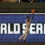 New York Mets' Yoenis Cespedes catches a ball at the wall hit by Kansas City Royals' Alex Rios during the fifth inning of Game 2 of the Major League Baseball World Series Wednesday, Oct. 28, 2015, in Kansas City, Mo. (AP Photo/David Goldman)