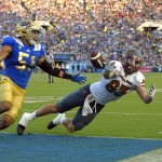 Arizona State wide receiver Ryan Jenkins, right, can't hold on to a pass while being defended  by UCLA defensive lineman Sam Tai during the first half of an NCAA college football game, Saturday, Oct. 3, 2015, in Pasadena, Calif. (AP Photo/Mark J. Terrill)