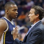 Utah Jazz head coach Quin Snyder, right, talks with Elijah Millsap during the first half of an NBA preseason basketball game against the Phoenix Suns, Friday, Oct. 9, 2015, in Phoenix. (AP Photo/Ross D. Franklin)