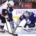 Toronto Maple Leafs goaltender James Reimer, right, makes a save against Arizona Coyotes' Shane Doan during first period NHL hockey action in Toronto on Monday, Oct. 26, 2015. (Frank Gunn/The Canadian Press via AP)
