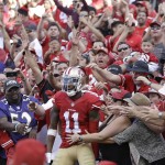 San Francisco 49ers wide receiver Quinton Patton (11) celebrates with fans after scoring on a touchdown reception against the Baltimore Ravens during the second half of an NFL football game in Santa Clara, Calif., Sunday, Oct. 18, 2015. (AP Photo/Ben Margot)