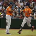 Houston Astros Colby Rasmus (28) celebrates with third base coach Gary Pettis after hitting a solo home run against the Arizona Diamondbacks in the forth inning during a baseball game, Saturday, Oct. 3, 2015, in Phoenix. (AP Photo/Rick Scuteri)