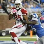 Arizona Cardinals tight end Darren Fells, defended by Detroit Lions middle linebacker Stephen Tulloch (55), scores on a 14-yard reception during the first half of an NFL football game, Sunday, Oct. 11, 2015, in Detroit. (AP Photo/Duane Burleson)