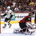 Pittsburgh Penguins' Phil Kessel (81) skates past Arizona Coyotes' Mike Smith (41) after scoring a goal as Coyotes' Oliver Ekman-Larsson (23), of Sweden, watches during the second period of an NHL hockey game Saturday, Oct. 10, 2015, in Glendale, Ariz. (AP Photo/Ross D. Franklin)