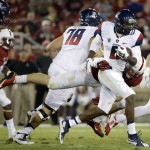 Arizona quarterback Jerrard Randall (8) is tackled by Stanford linebacker Joey Alfieri during the second half of an NCAA college football game Saturday, Oct. 3, 2015, in Stanford, Calif.  (AP Photo/Marcio Jose Sanchez)