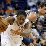 Phoenix Suns' Brandon Knight (3) collides with Utah Jazz's Raul Neto, right, of Brazil, during the first half of an NBA preseason basketball game Friday, Oct. 9, 2015, in Phoenix. (AP Photo/Ross D. Franklin)
