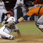 Houston Astros' Jason Castro, right, tags out Arizona Diamondbacks' Paul Goldschmidt, left, at home plate during the third inning of a baseball game Friday, Oct. 2, 2015, in Phoenix. (AP Photo/Ross D. Franklin)