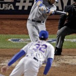 Kansas City Royals' Alex Gordon hits a RBI single off New York Mets starting pitcher Steven Matz during the fifth inning of Game 4 of the Major League Baseball World Series Saturday, Oct. 31, 2015, in New York. (AP Photo/Charlie Riedel)
