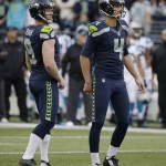 Seattle Seahawks kicker Steven Hauschka, right, and holder Jon Ryan watch as Hauschka's kick bounces off the uprights but still goes through for a field goal  in the first half of an NFL football game against the Carolina Panthers, Sunday, Oct. 18, 2015, in Seattle. (AP Photo/Elaine Thompson)