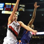 Portland Trail Blazers center Meyers Leonard (11) drives to the basket on Phoenix Suns guard Brandon Knight (3) during the fourth quarter of an NBA basketball game in Portland, Ore., Saturday, Oct. 31, 2015. The Suns won the game 101-90. (AP Photo/Steve Dykes)
