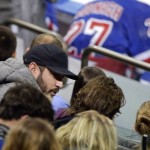 New York Mets' pitcher Matt Harvey, left, talks during the third period of an NHL hockey game between the New York Rangers and the Arizona Coyotes, Thursday, Oct. 22, 2015, in New York. The Rangers won 4-1. (AP Photo/Frank Franklin II)