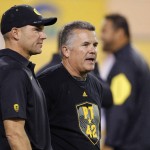 Arizona State head coach Todd Graham, right, talks with Oregon head coach Mike Helfrich, left, prior to an NCAA college football game Thursday, Oct. 29, 2015, in Tempe, Ariz. (AP Photo/Ross D. Franklin)