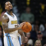 Denver Nuggets forward Wilson Chandler reacts after being called for a foul during the second half of the Nuggets' NBA basketball game against the Phoenix Suns on Friday, Oct. 16, 2015, in Denver. The Nuggets won 106-81. (AP Photo/David Zalubowski)