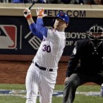 New York Mets' Michael Conforto watches his home run against the Kansas City Royals during Game 4 of the Major League Baseball World Series Saturday, Oct. 31, 2015, in New York. (AP Photo/Charlie Riedel)