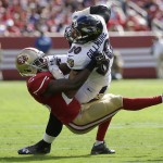 Baltimore Ravens tight end Crockett Gillmore (80) is tackled by San Francisco 49ers strong safety Jimmie Ward during the first half of an NFL football game in Santa Clara, Calif., Sunday, Oct. 18, 2015. (AP Photo/Marcio Jose Sanchez)
