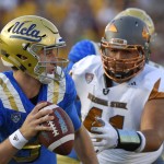 Arizona State linebacker Viliami Latu, right, gets ready to sack UCLA quarterback Josh Rosen for a safety during the first half of an NCAA college football game, Saturday, Oct. 3, 2015, in Pasadena, Calif. (AP Photo/Mark J. Terrill)