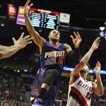 Phoenix Suns guard Sonny Weems (10) drives to the basket on Portland Trail Blazers forward Allen Crabbe (23) during the first quarter of an NBA basketball game in Portland, Ore., Saturday, Oct. 31, 2015. (AP Photo/Steve Dykes)