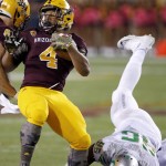 Arizona State's Demario Richard (4) spins away from a tackle attempt by Oregon's Christian French (96) during the first half of an NCAA college football game Thursday, Oct. 29, 2015, in Tempe, Ariz. (AP Photo/Ross D. Franklin)