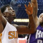 Phoenix Suns' Henry Sims, left, drives to the basket as Sacramento Kings' Willie Cauley-Stein (00) defends during the second half of an NBA preseason basketball game Wednesday, Oct. 7, 2015, in Phoenix. The Suns won 102-98. (AP Photo/Ross D. Franklin)