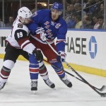 Arizona Coyotes' Shane Doan (19) fights for the puck with New York Rangers' Ryan McDonagh (27) during the first period of an NHL hockey game Thursday, Oct. 22, 2015, in New York. (AP Photo/Frank Franklin II)