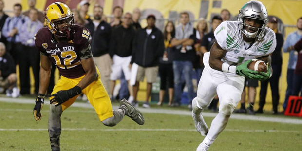 Oregon's Arrion Springs (1) intercepts a pass intended for Arizona State's Tim White (12) during th...