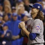 New York Mets pitcher Jacob deGrom looks at the scoreboard after giving up an RBI single to Kansas City Royals' Alcides Escobar during the fifth inning of Game 2 of the Major League Baseball World Series Wednesday, Oct. 28, 2015, in Kansas City, Mo. (AP Photo/Matt Slocum)