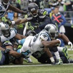Carolina Panthers running back Jonathan Stewart dives in for a touchdown in the second half of an NFL football game against the Seattle Seahawks, Sunday, Oct. 18, 2015, in Seattle. (AP Photo/Stephen Brashear)