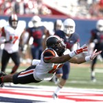 Oregon State cornerback Kendall Hill dives for the football during the second half of an NCAA college football game against Arizona, Saturday, Oct. 10, 2015, in Tucson, Ariz. (AP Photo/Rick Scuteri)
