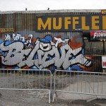 Graffiti adorns a repair shop outside of Citi Field before Game 4 of the Major League Baseball World Series between the New York Mets and the Kansas City Royals Saturday, Oct. 31, 2015, in New York. (AP Photo/Peter Morgan)