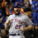 New York Mets' Daniel Murphy reacts as he scores from second on a hit by Lucas Duda during the fourth inning of Game 2 of the Major League Baseball World Series against the Kansas City Royals Wednesday, Oct. 28, 2015, in Kansas City, Mo. (AP Photo/David J. Phillip)