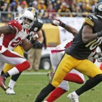 Pittsburgh Steelers wide receiver Martavis Bryant (10) evades Arizona Cardinals free safety Rashad Johnson (26) and Tyrann Mathieu (32) on his way to a touchdown after making a catch in the fourth quarter an NFL football game Sunday, Oct. 18, 2015 in Pittsburgh. The Steelers won 25-13. (AP Photo/Gene J. Puskar)