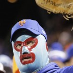 A New York Mets fan cheers during the fifth inning of Game 4 of the Major League Baseball World Series against the Kansas City Royals Saturday, Oct. 31, 2015, in New York. (AP Photo/David J. Phillip)